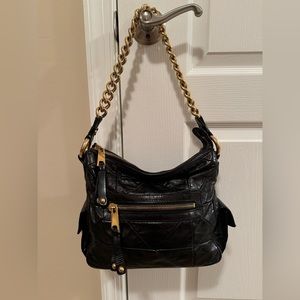 Marc Jacobs black quilted shoulder bag with gold chain.